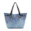 The Buckle Accented Sparkling Tote Handbag is a blue faux leather tote with black handles and a grid of silver studs on the front. Metal grommet accents near the handles add extra style. This bag is tablet compatible.