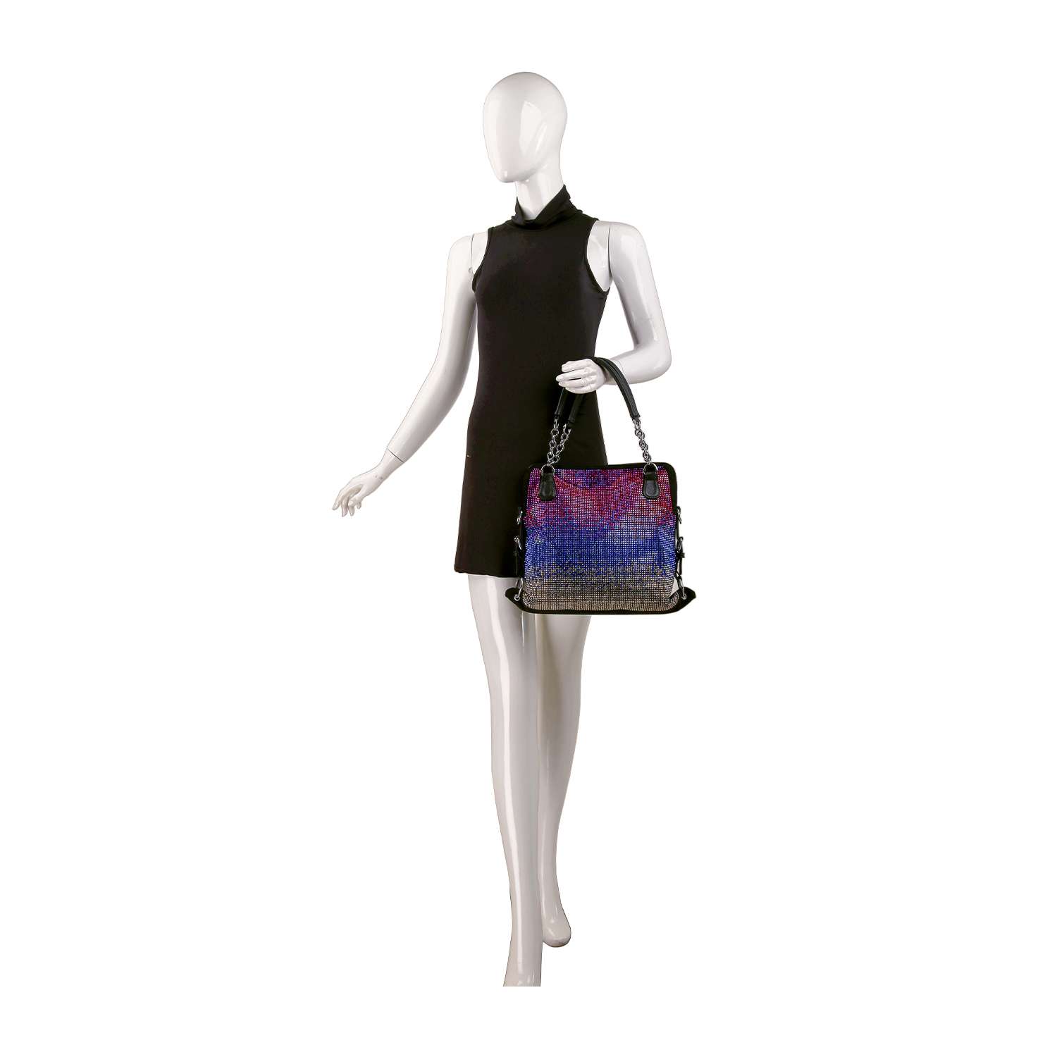 A mannequin in a sleeveless black dress holds the Colorful Ombre Rhinestone Design Fashion Handbag, featuring purple, blue, and beige hues with black handles and faux leather material, against a white background.