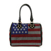 The Rhinestone Flag Design Locked Satchel features a bold USA flag pattern with red, white, and blue rhinestones, plus two black handles accented by gold studs—perfect for a standout patriotic look.