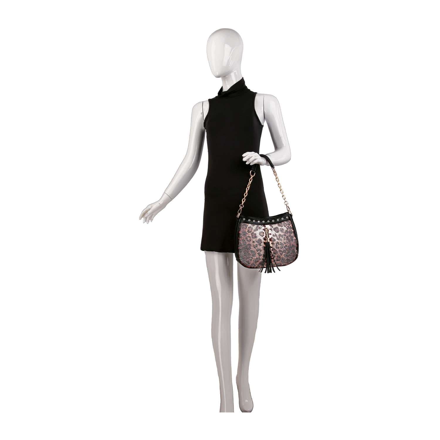 A mannequin in a sleeveless black dress holds the Decorative Rhinestone Tassel Accented Hobo Handbag—a leopard-print crossbody with a gold chain strap, black tassel, and rhinestone detailing—against a plain white background.