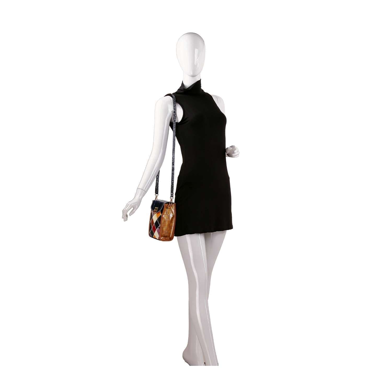 A faceless mannequin wears a sleeveless black mini dress and carries the Genuine Leather Colorful Petite Crossbody Sling, a small multicolored bag with an adjustable strap, standing against a plain white background.
