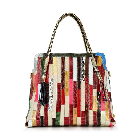 The Genuine Leather Colorful Tall Tote is a spacious bag with two braided handles, a patchwork design, tasseled zipper pulls, and a secure top zip closure—perfect for carrying essentials in vibrant style.