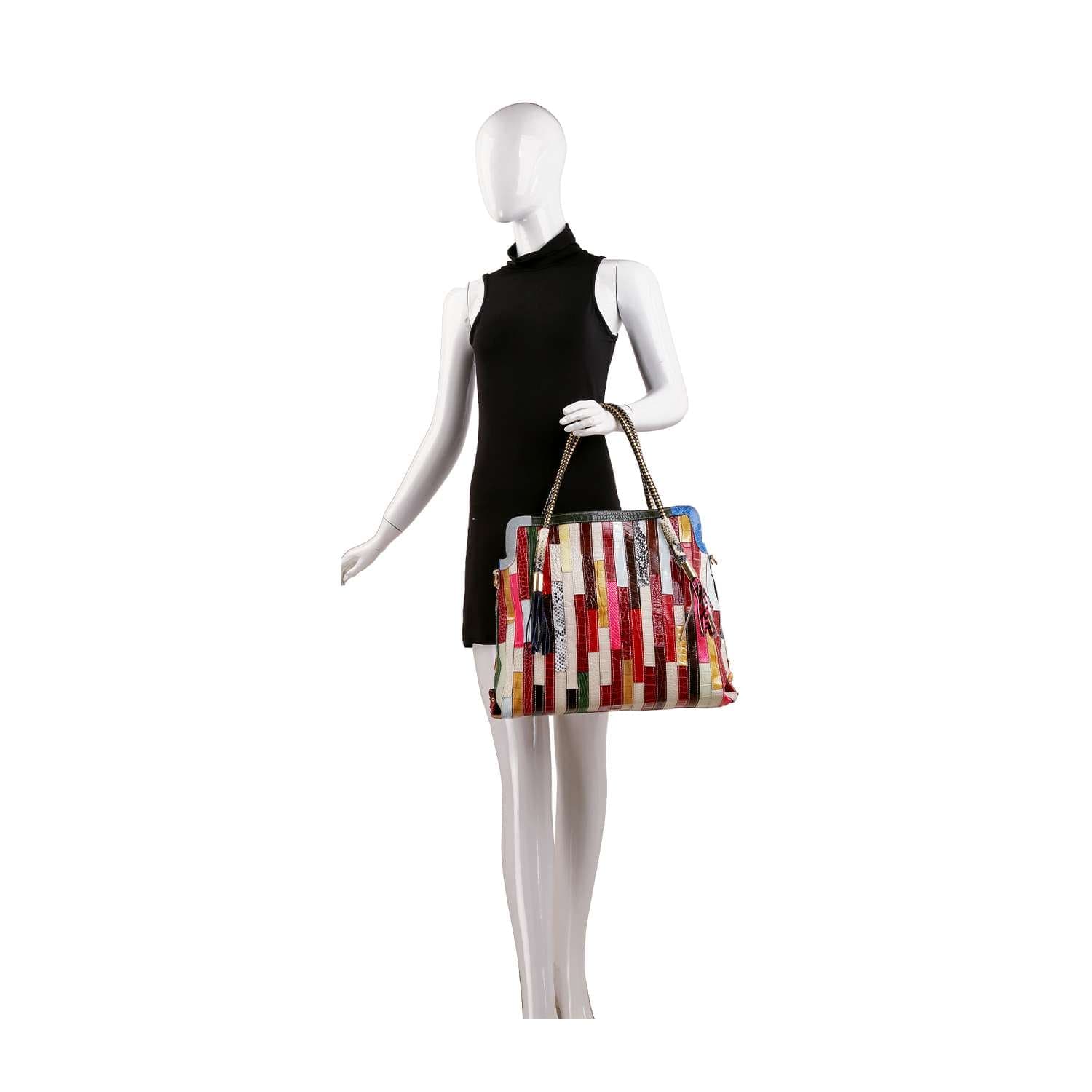 A mannequin in a sleeveless black dress holds the Genuine Leather Colorful Tall Tote, a rectangular bag with vertical multicolor stripes, text designs, and an adjustable strap.