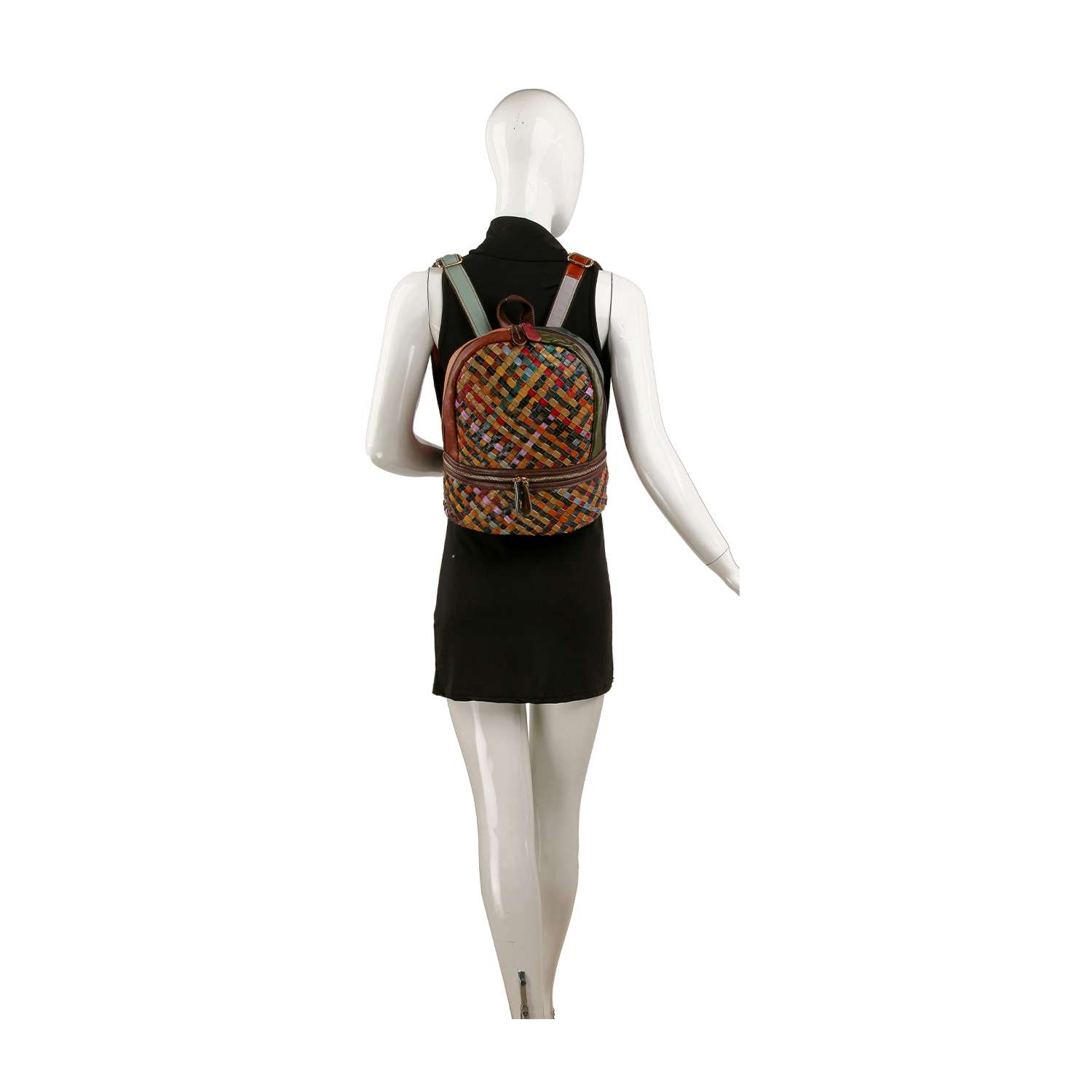 A mannequin in a black sleeveless dress models the Genuine Leather Woven Backpack, featuring a small, colorful pattern and worn over its shoulders, set against a plain white background.