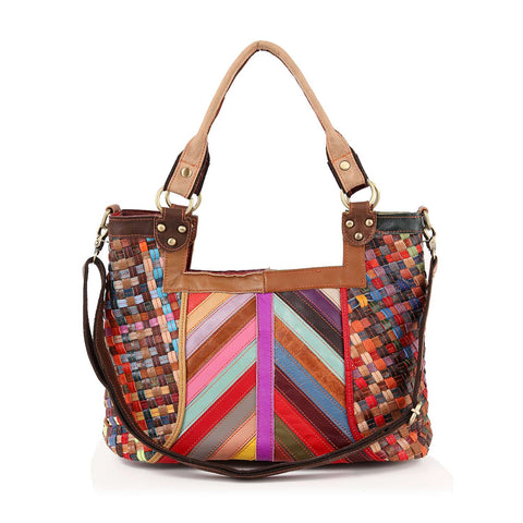 The Genuine Leather Colorful Woven Shoulder Bag features multicolored woven panels, brown leather handles, a dark removable strap, and gold-tone hardware—its vibrant diagonal and vertical patterns make it a standout for daily use.