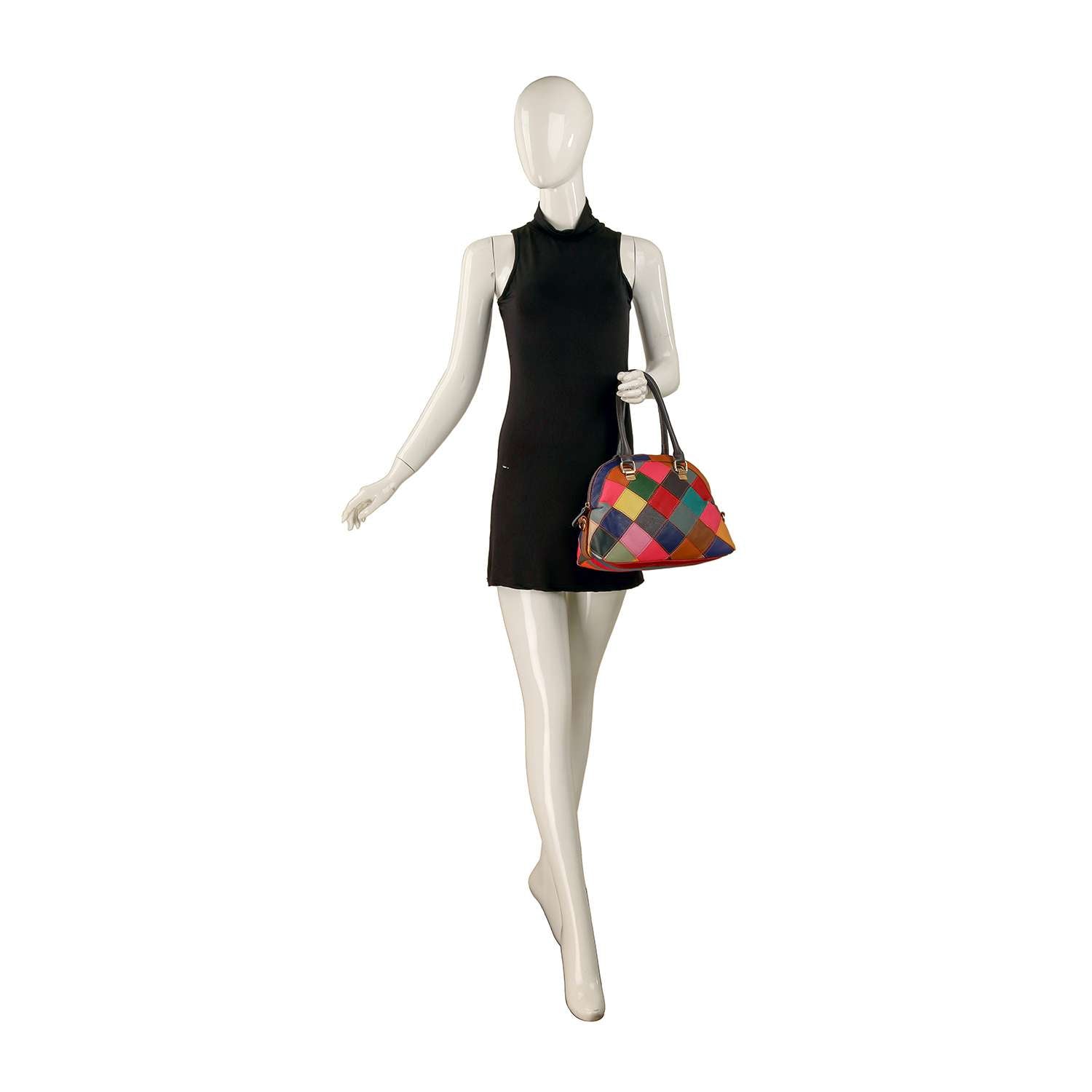 A mannequin in a sleeveless black mini dress holds the Genuine Leather Colorful Satchel Handbag with vibrant checkered patterns, perfect for everyday use. The background is plain white.