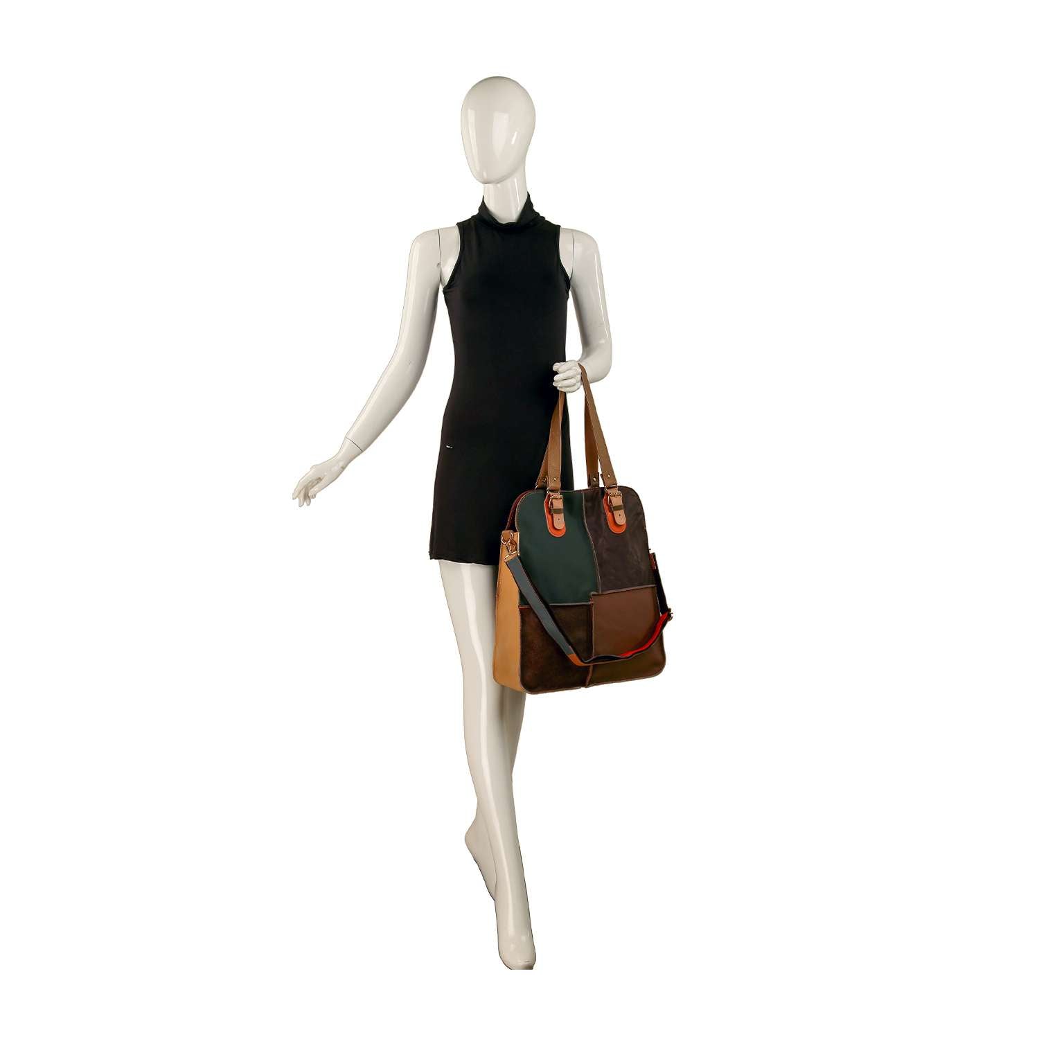 A mannequin in a sleeveless black dress stands with one hand on its hip, holding the Genuine Leather Tall Patchwork Fashion Tote—featuring brown, green, black, and tan sections with tan handles and gold-toned hardware for a chic touch.