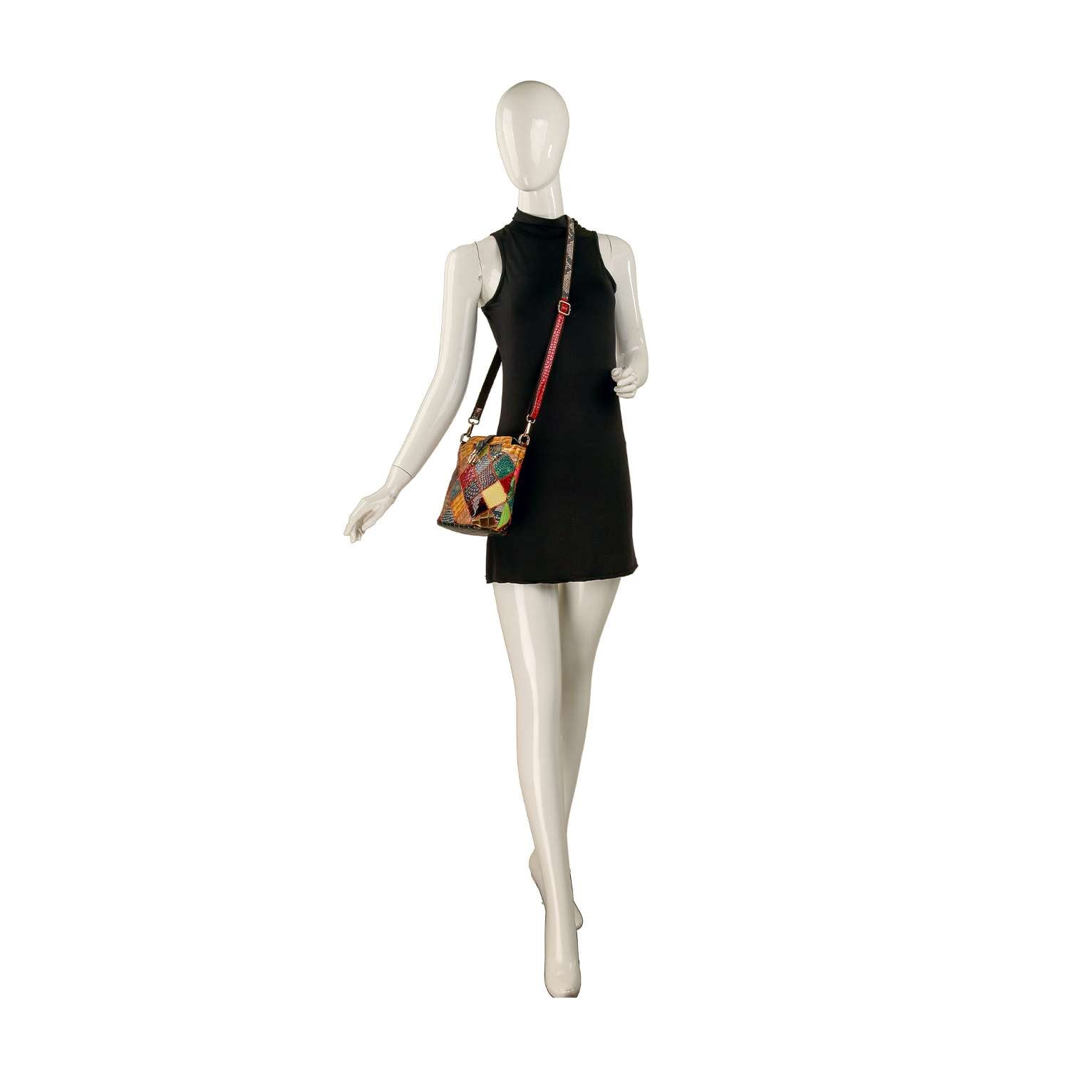 A white mannequin in a sleeveless black mini dress holds the Genuine Leather Patchwork Top Flap Crossbody Bag with an adjustable strap, posed against a plain white background.