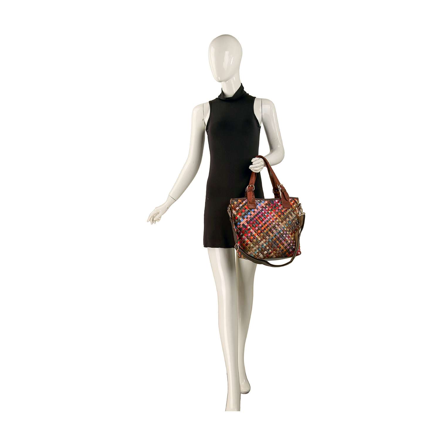 A mannequin in a sleeveless black dress poses holding the Genuine Leather Woven Colorful Tote with brown handles against a white background.