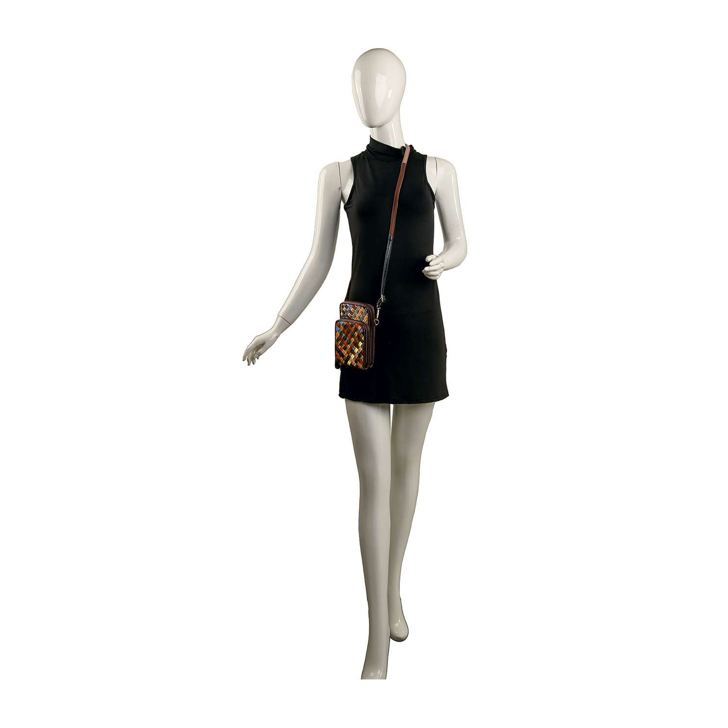 A mannequin in a sleeveless black mini dress holds the Genuine Leather Woven Front Pocket Crossbody, displaying its colorful woven design, against a plain white background.
