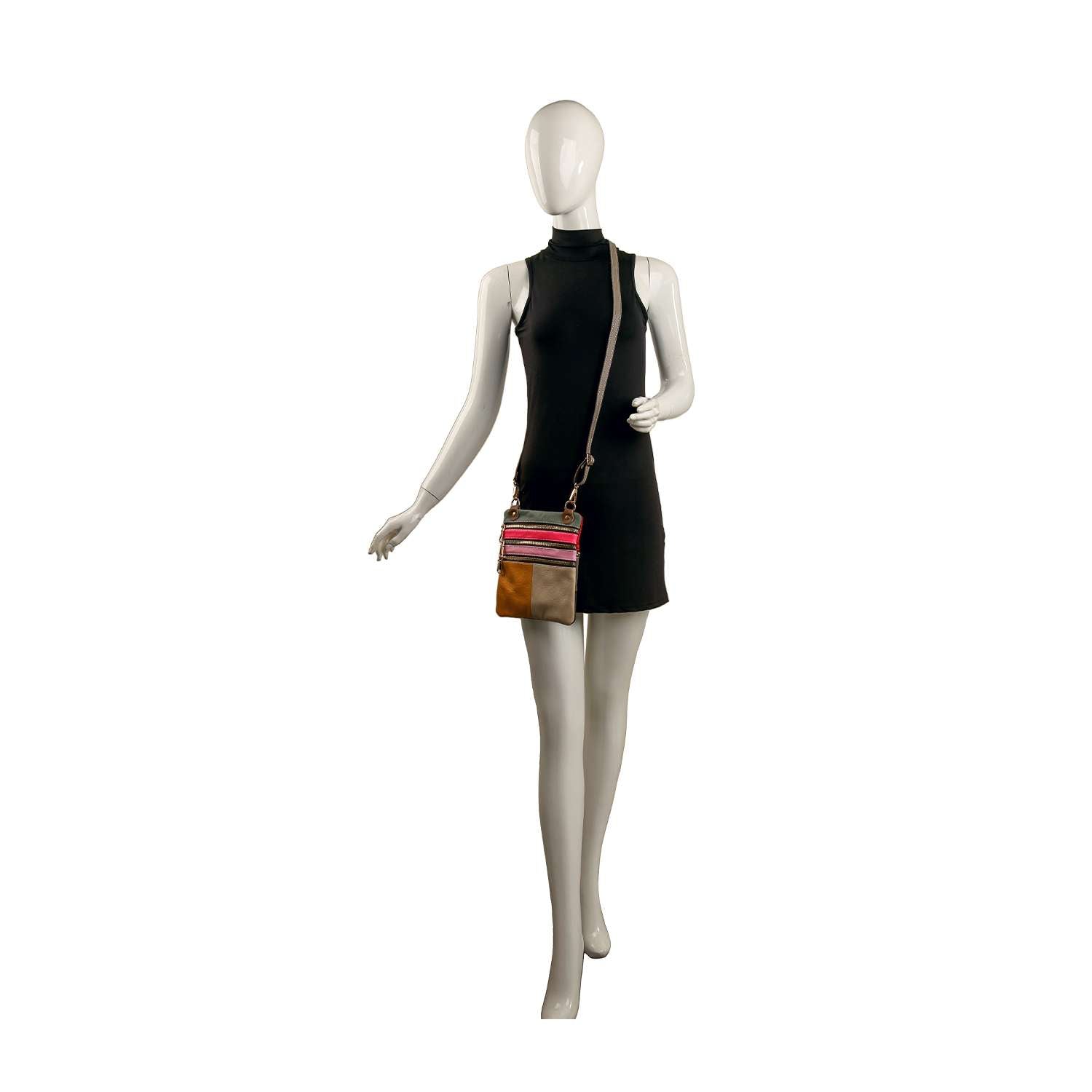 A mannequin in a sleeveless black dress displays the Genuine Leather Color Block Crossbody, featuring bold pink, red, and brown stripes, set against a white background.