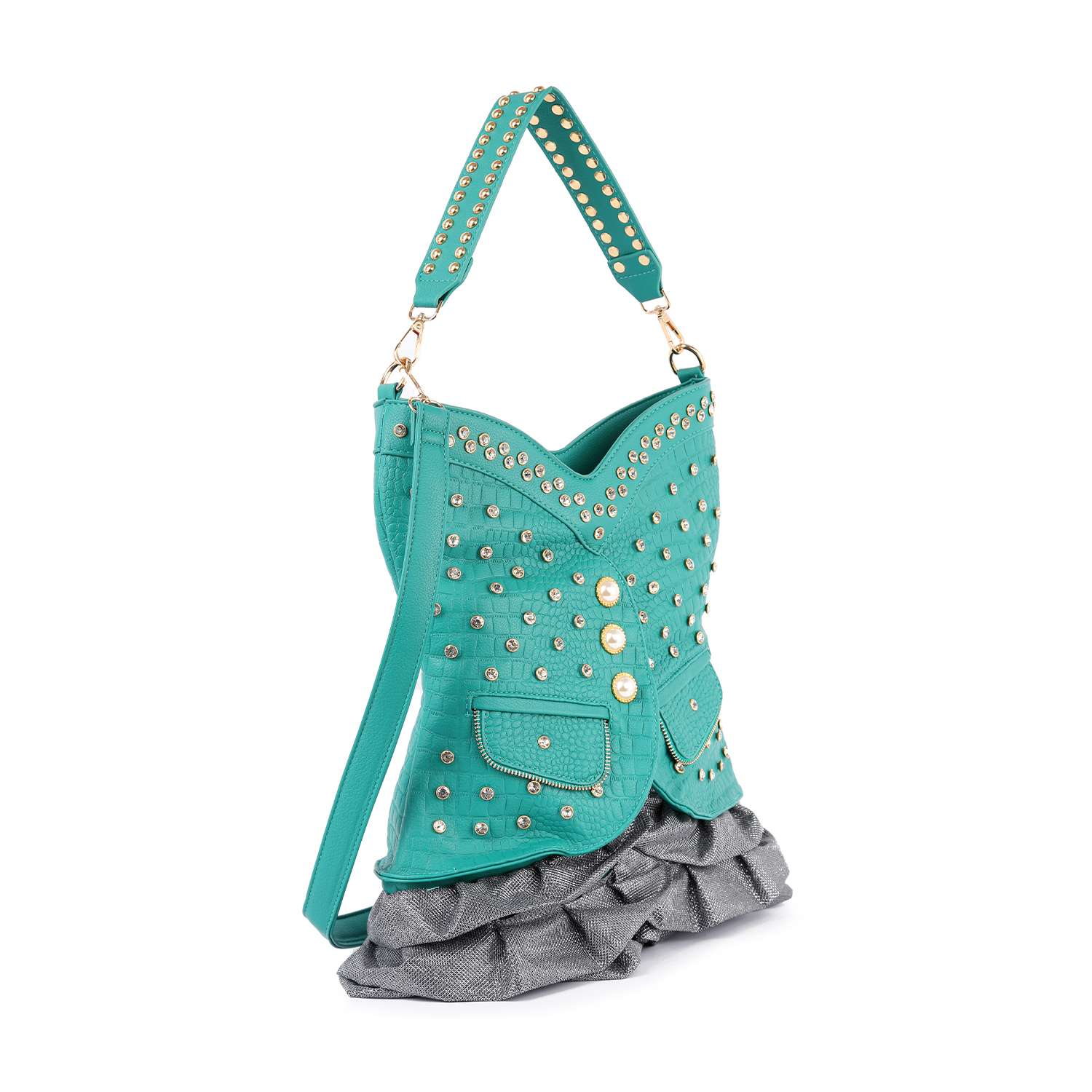 The Dazzling Vest Design Tall Hobo Handbag is a turquoise metallic bag with gold studs, flap pockets, ruffled gray fabric at the bottom, a matching studded handle, and a long strap, styled to resemble a jacket.