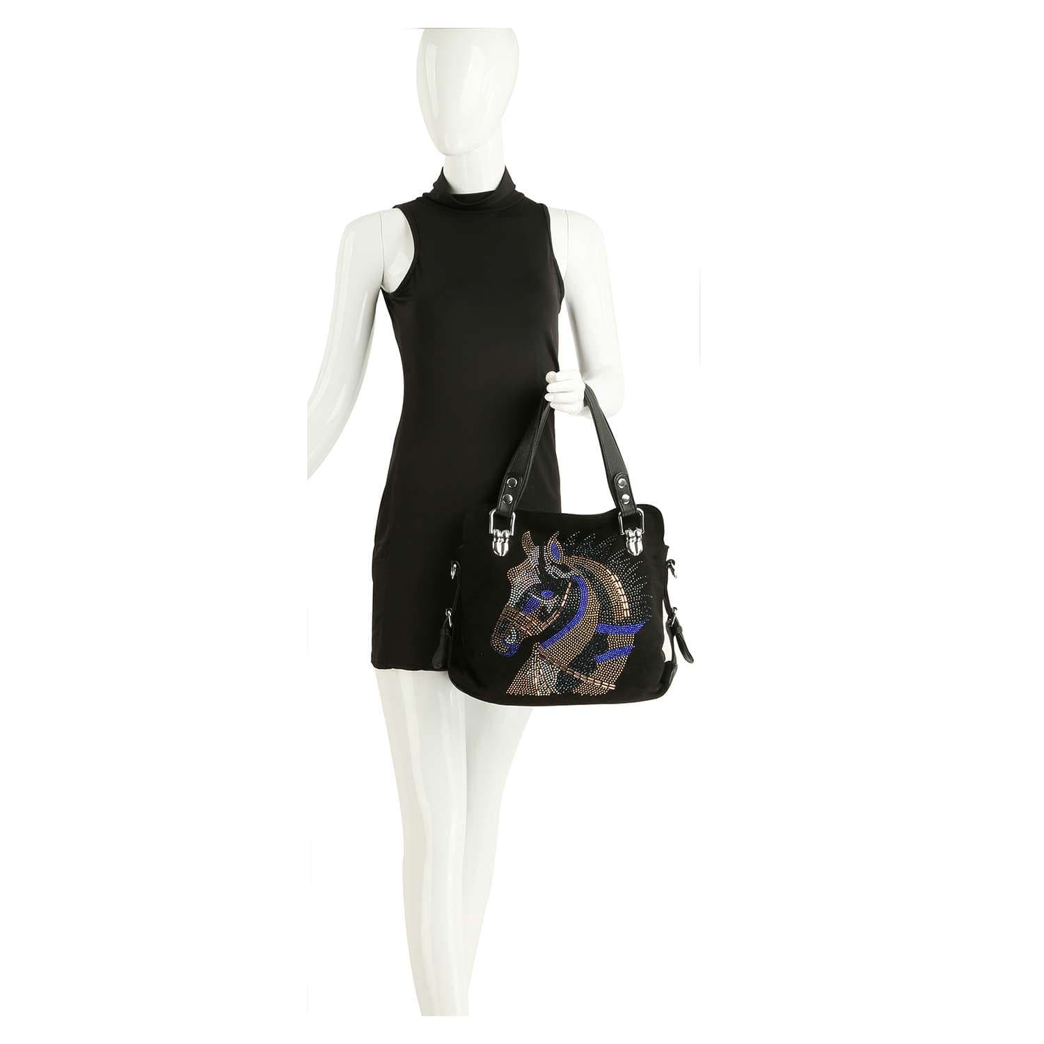 A mannequin in a black sleeveless dress holds the Horse Design Rhinestone Covered Handbag, which features a decorative horse head with silver, blue, and purple rhinestones.