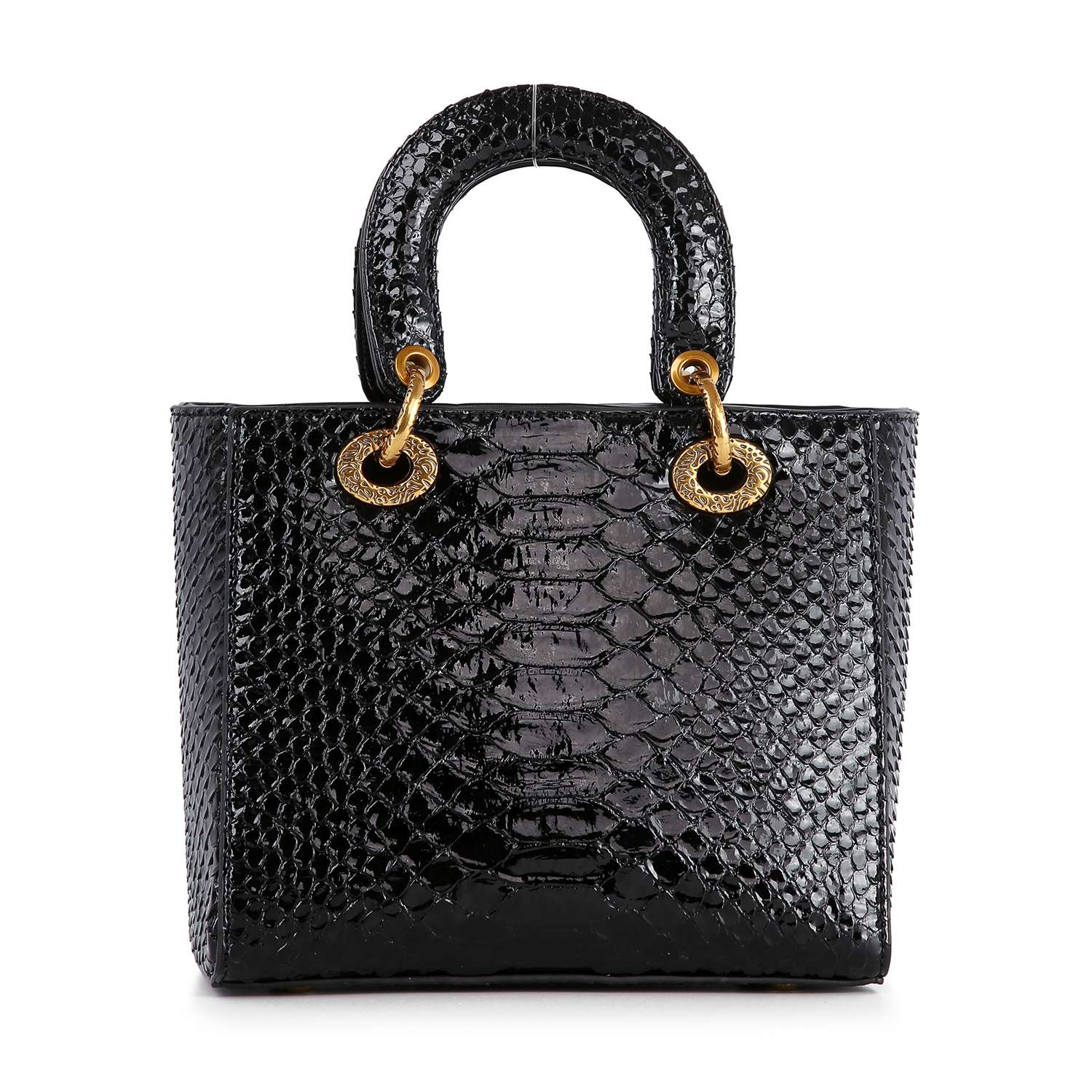 The Colored Stone Grid Pattern Tote Handbag features a black, glossy faux leather with a crocodile-embossed finish, dual short handles, and gold grommet accents at their base, shown against a white background.
