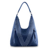 The Sparkling Rhinestone Accented Hobo Handbag is a spacious blue faux leather shoulder bag with a single strap, V-shaped rhinestone accents, two zippered pockets with tassel pulls, and fits most tablets—perfect for daily use.