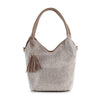 The Stunning Sparkling Tall Shoulder Bag is a beige faux leather shoulder bag embellished with sparkling stones, a matching handle, and a decorative side tassel with gold accents.