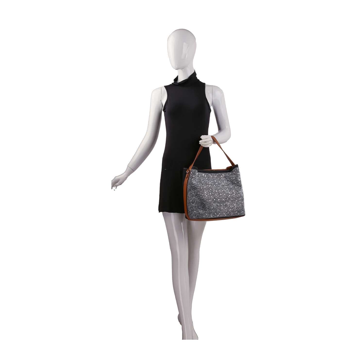 A mannequin in a sleeveless black dress holds the Rhinestone Denim Fashion Hobo, featuring a large sparkling design and brown handles, against a plain white background.