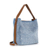 The Rhinestone Denim Fashion Hobo features light blue denim with a sparkling dotted pattern, brown leather shoulder strap, and matching side strap, displayed against a white background.