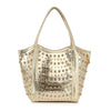 The Studded Rhinestone Alligator Embossed Tote Handbag features a shiny gold finish, rhinestone studs, two handles, an alligator texture, and a structured design that fits a tablet—perfect for a bold, glamorous look.