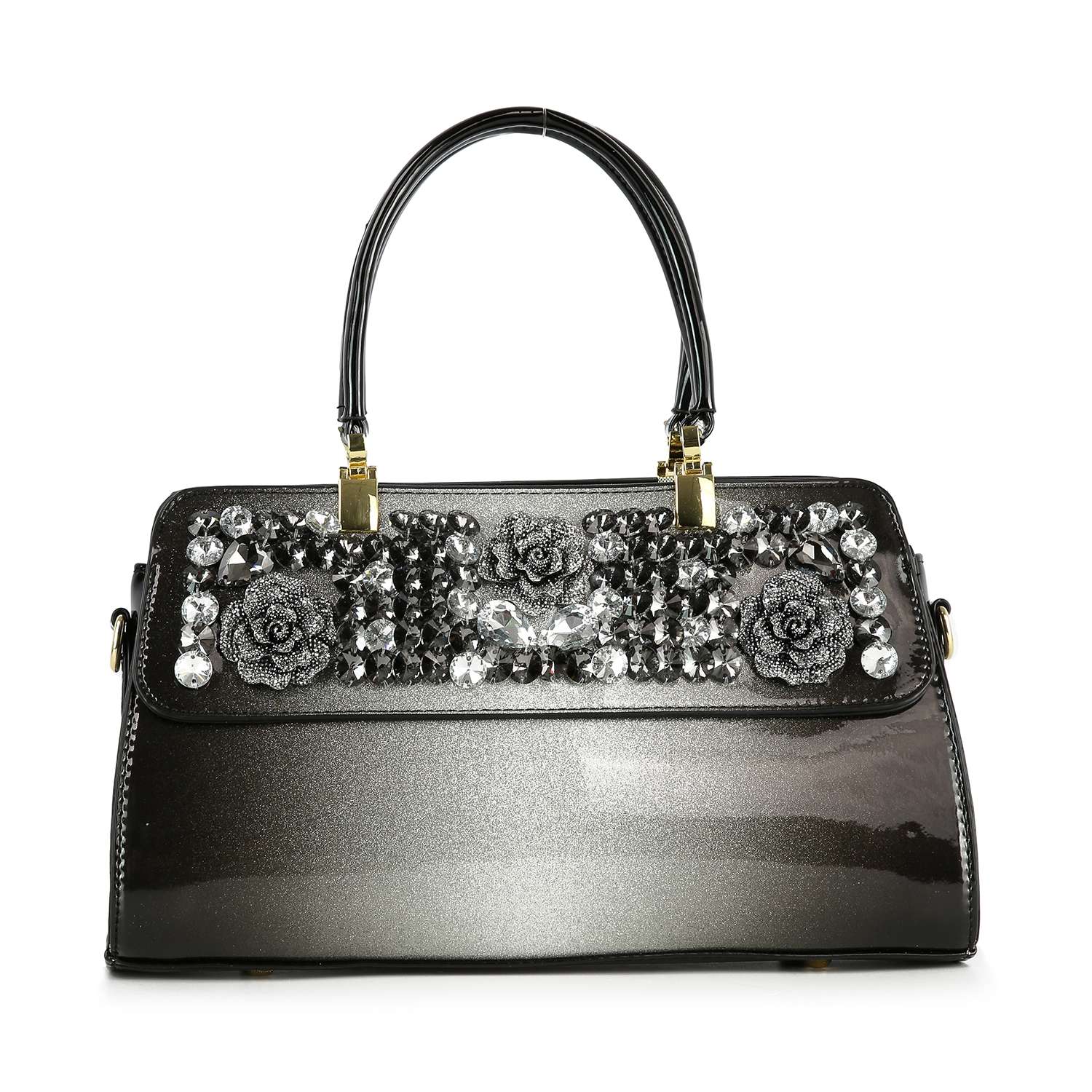 The Sparkling Patent Decorative Hand Tote is a glossy black faux leather bag with dual handles, sparkling rhinestones, and three large silver floral accents on the front flap.