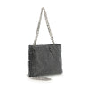 The Metal Mesh Evening Bag is a rectangular black shoulder bag with a shiny silver chain strap and metal mesh exterior adorned with a checkered pattern of silver studs, displayed against a white background.