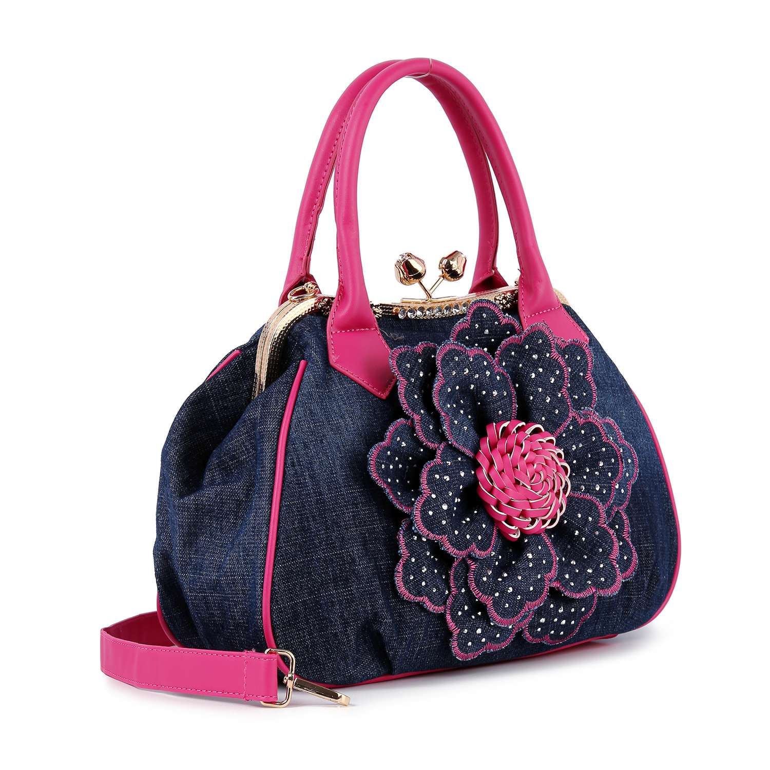 The Raised Flower Metal Frame Hand Tote is a stylish handbag in dark blue denim with pink handles, trim, and a detachable strap. It features a large denim flower with pink stitching, rhinestones, and vintage-chic appeal.