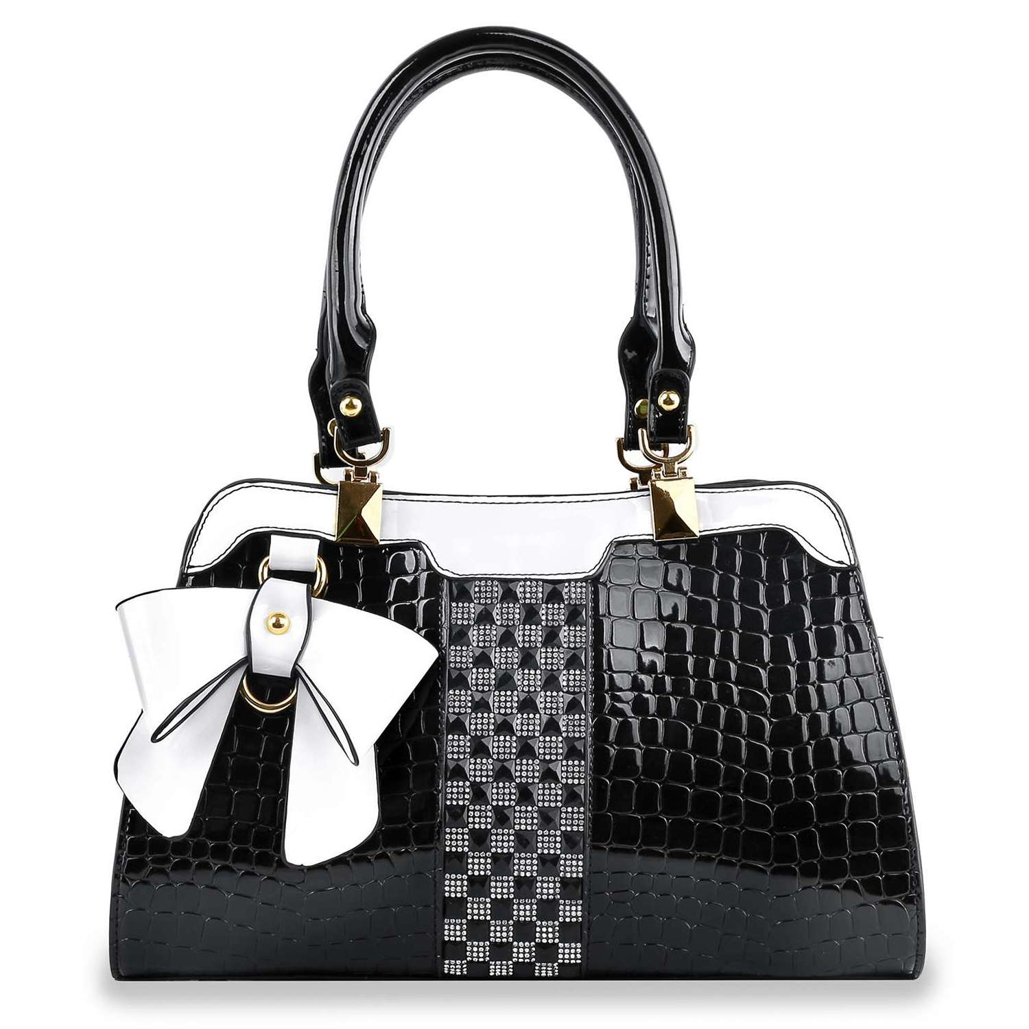 The Brilliant Bow Sparkling Hand Tote is a stylish black embossed croc bag with a glossy finish, gold hardware, a large white bow, and a vertical center strip featuring a geometric black and white pattern.