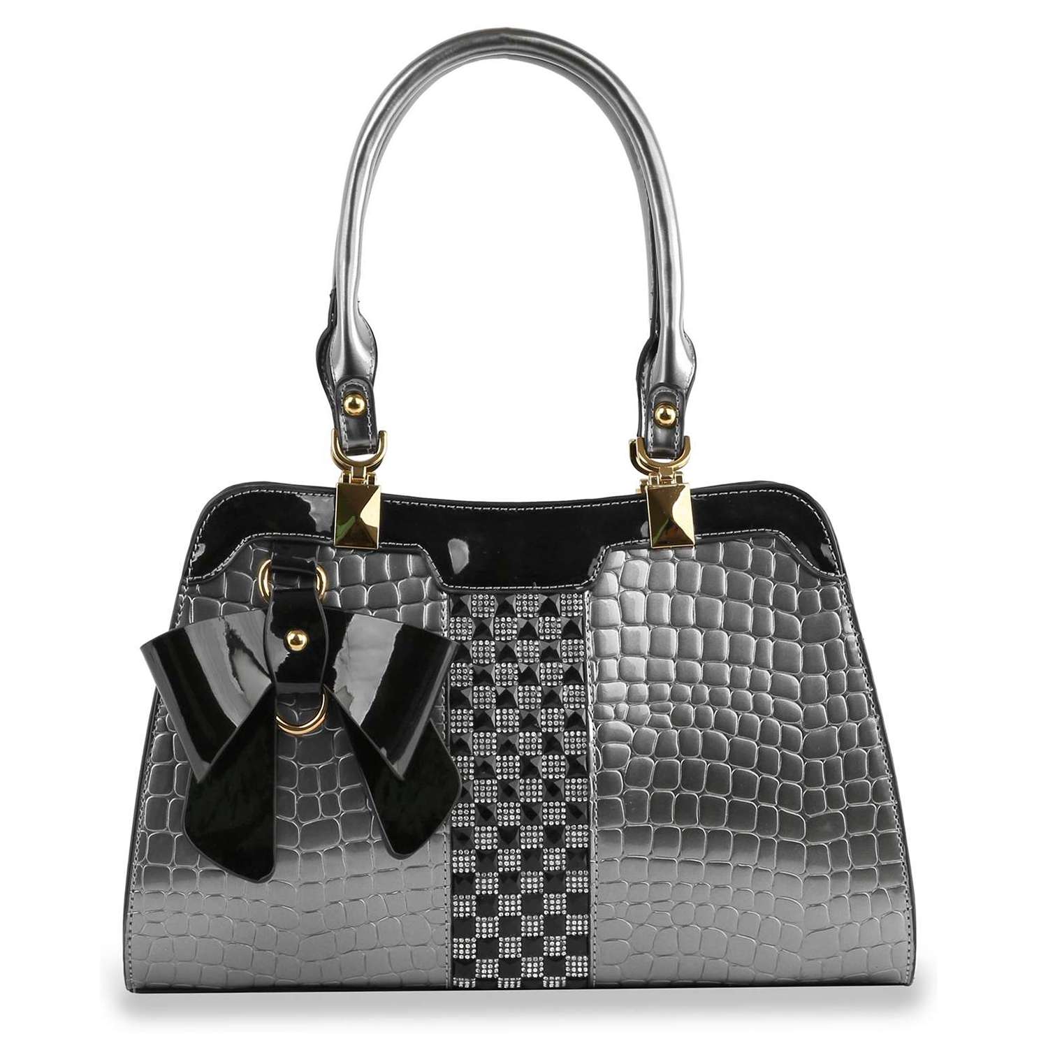 The Brilliant Bow Sparkling Hand Tote is a silver embossed croc handbag with a black checkered center stripe, gold hardware, a large black bow accent on one side, glossy faux leather finish, and two handles for easy carrying.