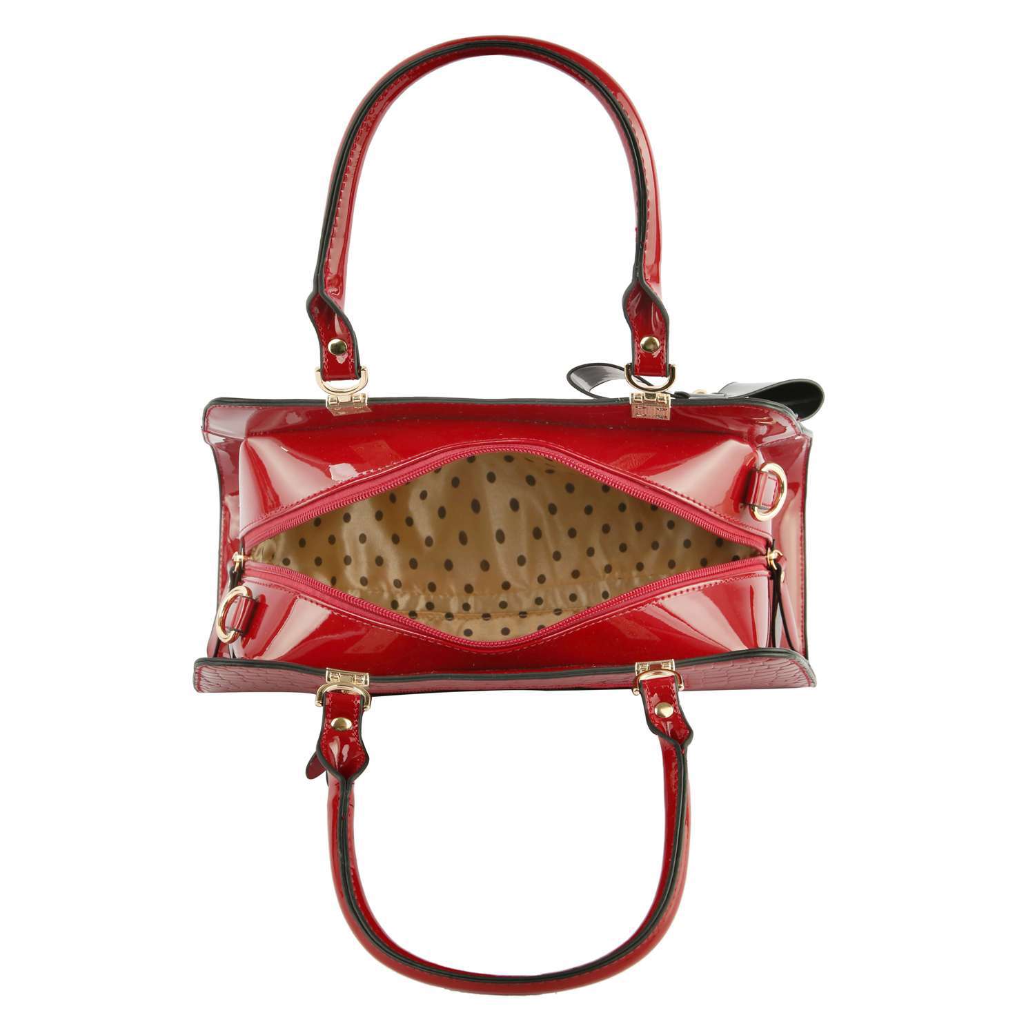 Top view of the Brilliant Bow Sparkling Hand Tote, an open red faux leather bag with gold hardware and a beige lining with black polka dots, showcasing its zippered main compartment.
