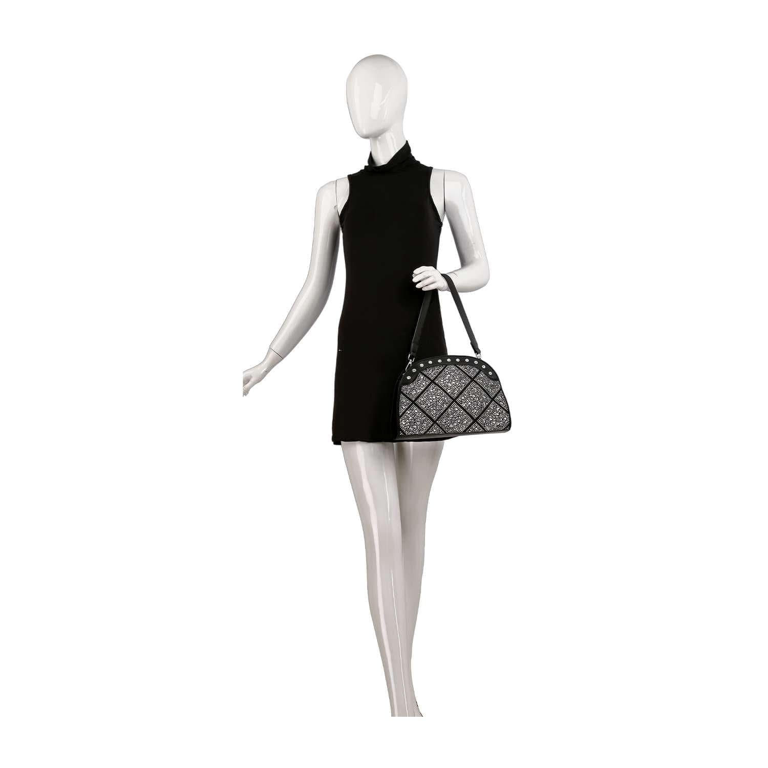 A mannequin in a sleeveless black dress stands upright, holding the Super Sparkling Shoulder Bag by its side. The background is plain white.