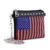 The Rhinestone Flag Crossbody Sling is a small black faux leather bag with a silver chain strap, featuring chic rhinestones in a sparkling American flag design on the front.