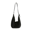 The Dazzling Rhinestone Hobo Handbag is a black faux leather bag with an adjustable strap, subtle sparkling embellishments, and a flap closure, displayed against a plain white background.