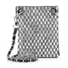 The Petite Rhinestone Bling Crossbody Sling features a black and silver checkered pattern with studs and rhinestones, plus a stylish chain and leather strap.