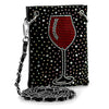 The Red Wine Glass Petite Crossbody Sling is a small faux leather bag adorned with rhinestones in a red wine glass design and features a metal chain strap attached by large metal rings.