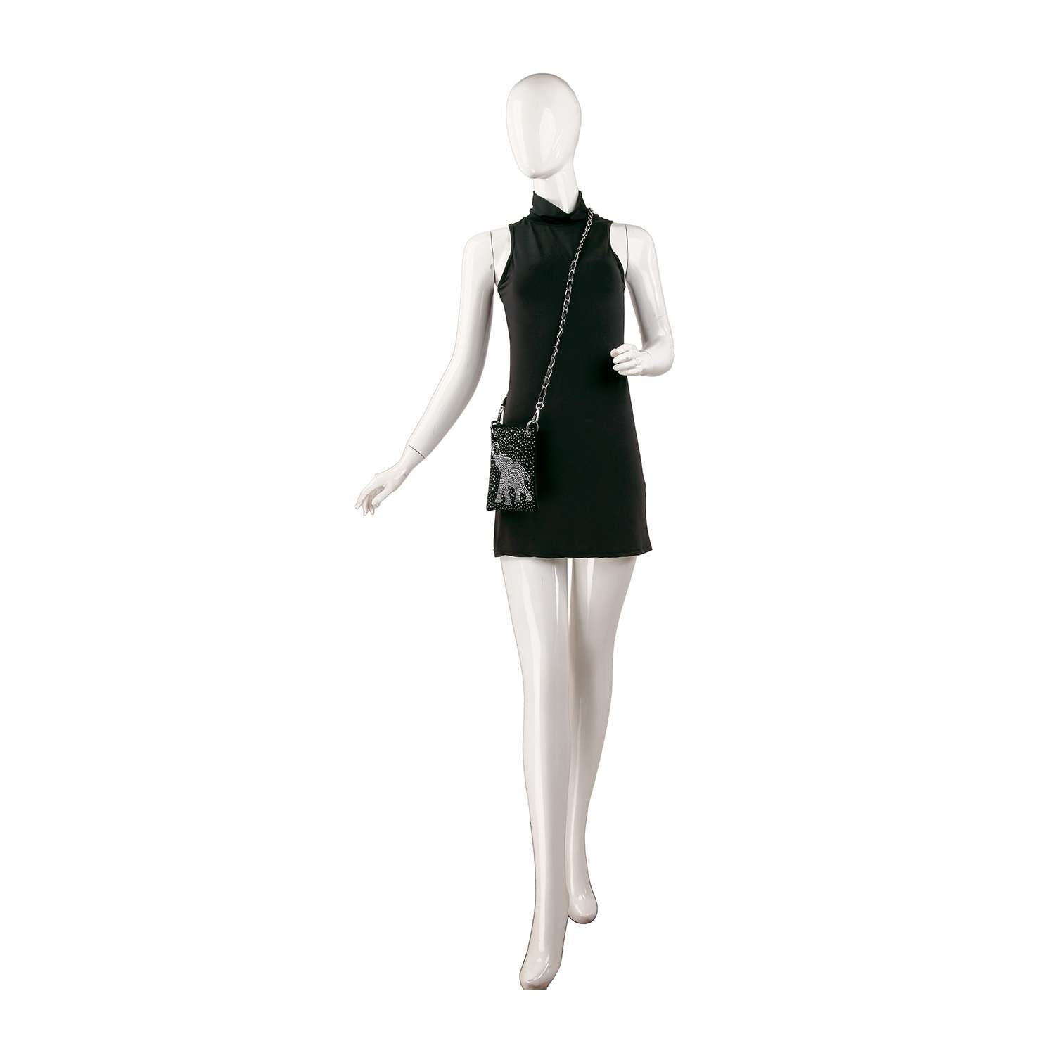 A white mannequin stands against a plain white background wearing a sleeveless short black dress and the Rhinestone Elephant Design Petite Crossbody Sling with a fringed bottom.