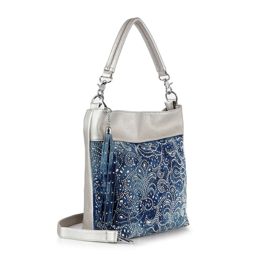 The Layered Lace Pattern Hobo Handbag features silver faux leather sides and handles, a detachable strap, blue front with white lace and rhinestone accents, plus a matching blue and silver tassel on the side.