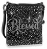 The Blessed Rhinestone Crossbody Sling is a black faux leather bag with silver studs, a rhinestone pattern, and the word Blessed in sparkling cursive accents.