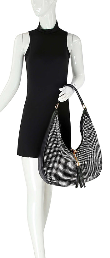 A mannequin in a sleeveless black high-neck mini dress holds the Sparkling Large Hobo Handbag, adorned with shimmering rhinestones and playful tassel zipper details.
