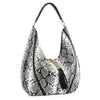 The Tassel Accented Hobo Handbag is a large, slouchy hobo bag with a bold black and white snakeskin print, black handle, gold hardware, and chic tassel accents hanging from the zipper.