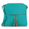 The Tassel Accented Crossbody Sling is a turquoise, lightweight bag with gold zipper, dual tassel accents, an adjustable strap, and a pebbled faux leather finish.