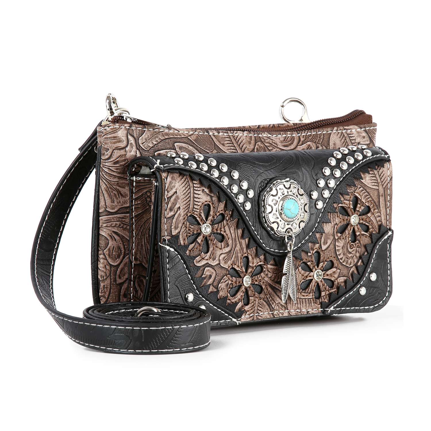The Western Design Petite Crossbody Sling features brown and black faux leather, embossed floral patterns, silver studs, a turquoise stone centerpiece, a detachable strap, and tablet compatibility for stylish western flair.
