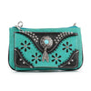 The Western Design Petite Crossbody Sling features turquoise and black faux leather, floral cutouts, silver studs, a central turquoise stone, and a silver feather charm on the front.