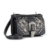 The Western Buckle Design Petite Crossbody Sling is a black faux leather bag with silver floral embroidery, decorative studs, and a large ornate buckle. It features a detachable strap, zipper closure, and fits a tablet for convenience.