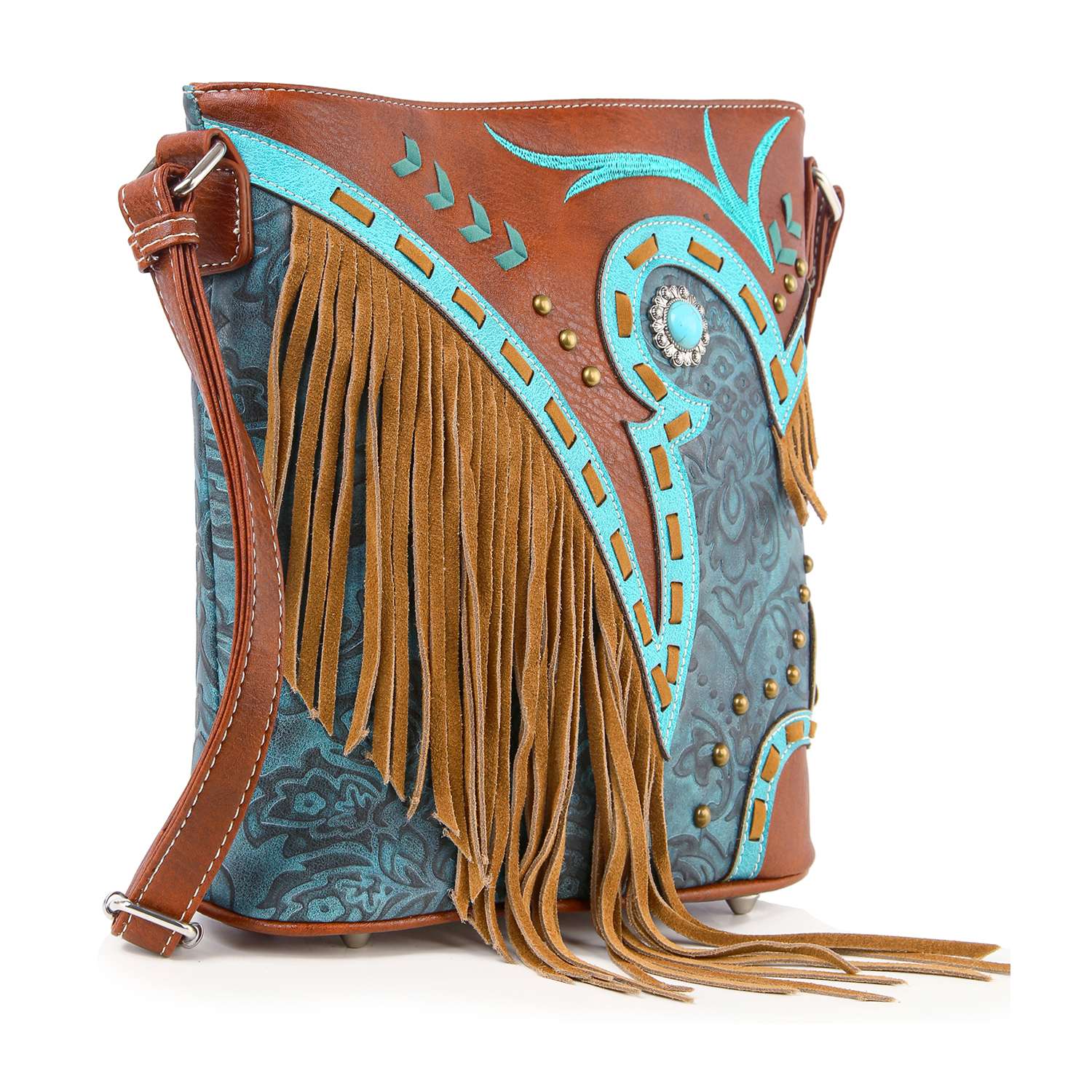 The Western Fringe Design Crossbody Sling features a brown and teal floral pattern, turquoise accents, decorative studs, a large concho, and long tan suede fringe. This stylish faux leather bag adds everyday flair to your look.