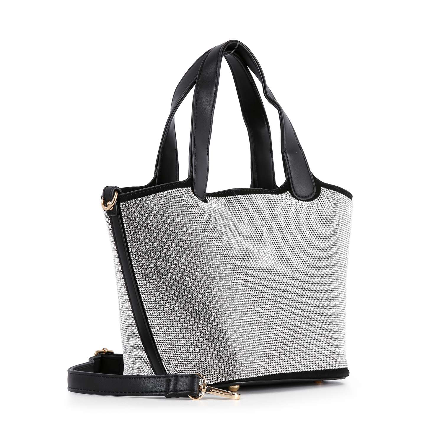 The Stunning Rhinestone Covered Hand Tote features black handles and trim, a textured white and gray fabric exterior, a detachable black shoulder strap with gold hardware, and stands upright against a white background.