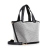 The Stunning Rhinestone Covered Hand Tote features black handles and trim, a textured white and gray fabric exterior, a detachable black shoulder strap with gold hardware, and stands upright against a white background.