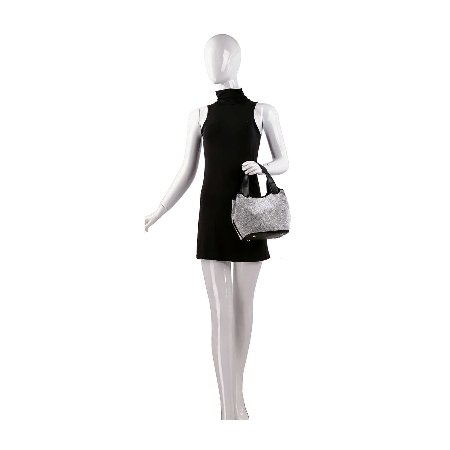 A white mannequin in a sleeveless black mini dress holds the Stunning Rhinestone Covered Hand Tote with black handles against a plain white background.