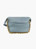 The Chain Accented Front Flap Shoulder Bag is a light blue faux leather handbag with a soft, rounded shape and chunky gold-toned hardware chain along the bottom edge, displayed against a plain white background.