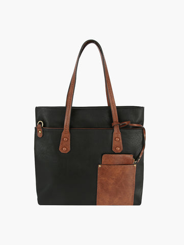 The Two Toned Tall Tote Handbag is a black faux leather tote with brown handles, a matching front pocket, gold-tone hardware, and an elegant design. Tablet compatible and shown on a white background.