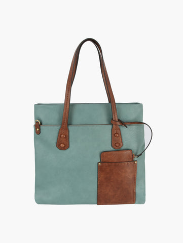 The Two Toned Tall Tote Handbag is a light blue faux leather tote with brown handles, a matching detachable pouch, and a top zip closure, showcased against a plain white background.